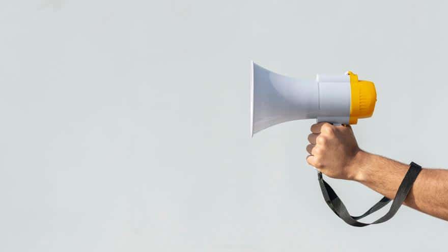Hand holding megaphone