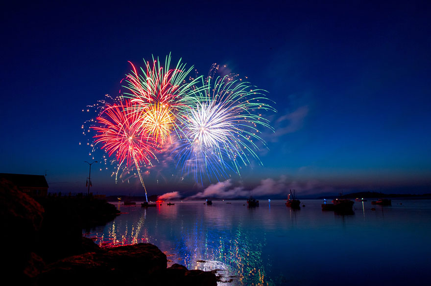 A fireworks display in the harbor