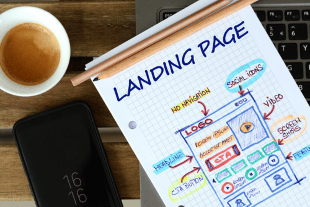 Image of a landing page mockup on a gridded notebook
