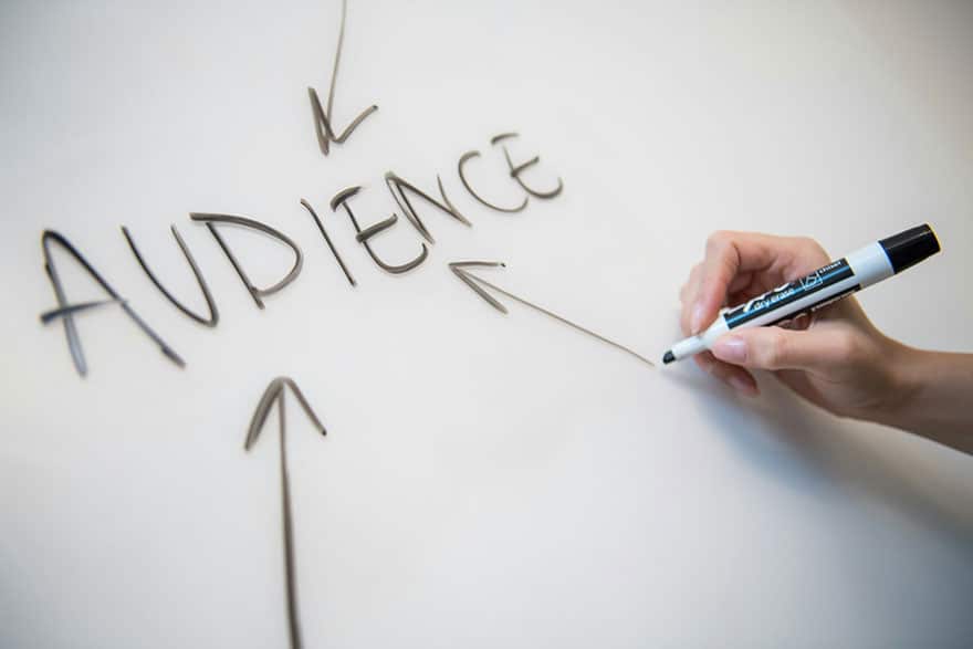 Arrows pointing to the word Audience written on a whiteboard