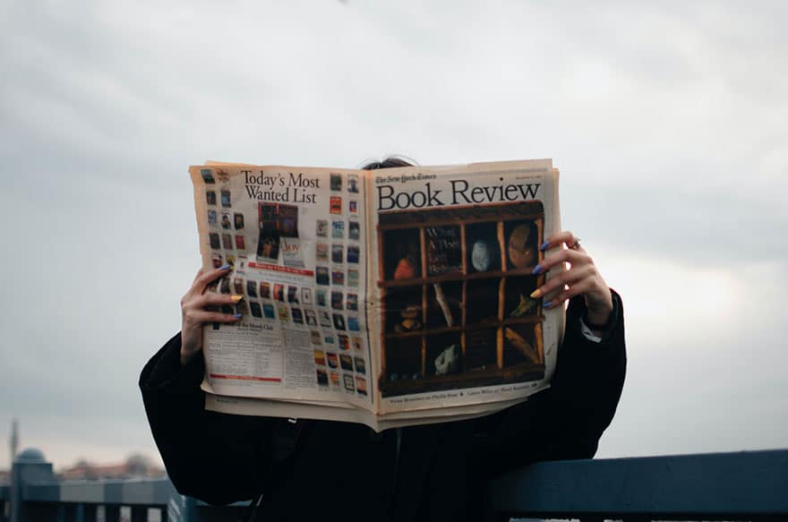 Person reading a book review