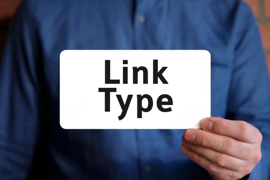 Person with blue shirt holding a white paper with “Link Type” written on it